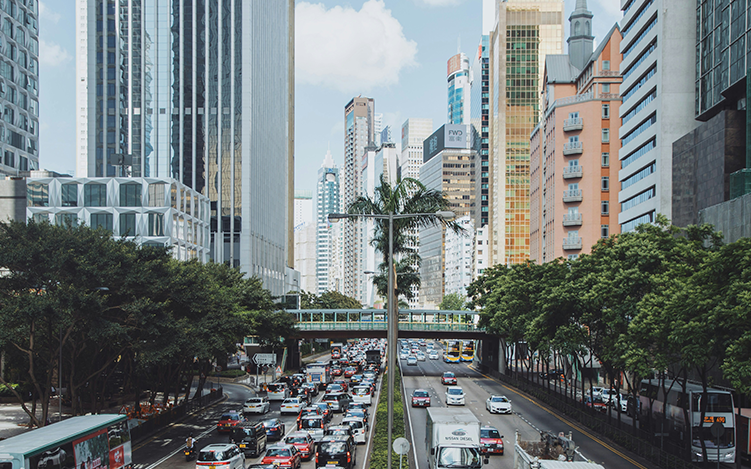 City scape with cars stuck in traffic