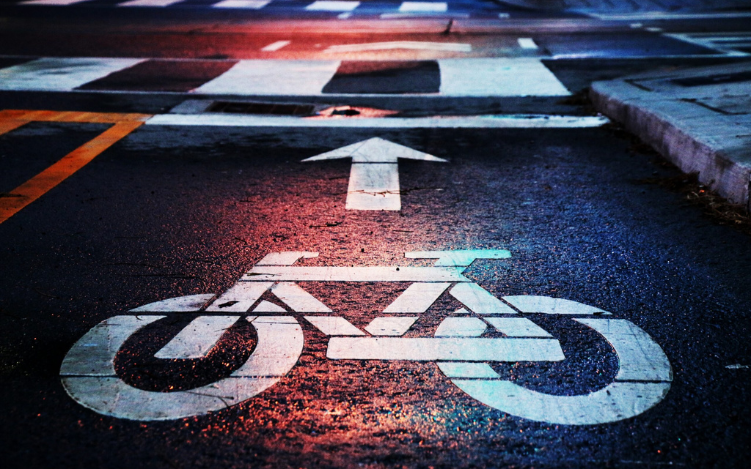 Picture of a bike lane icon on the street